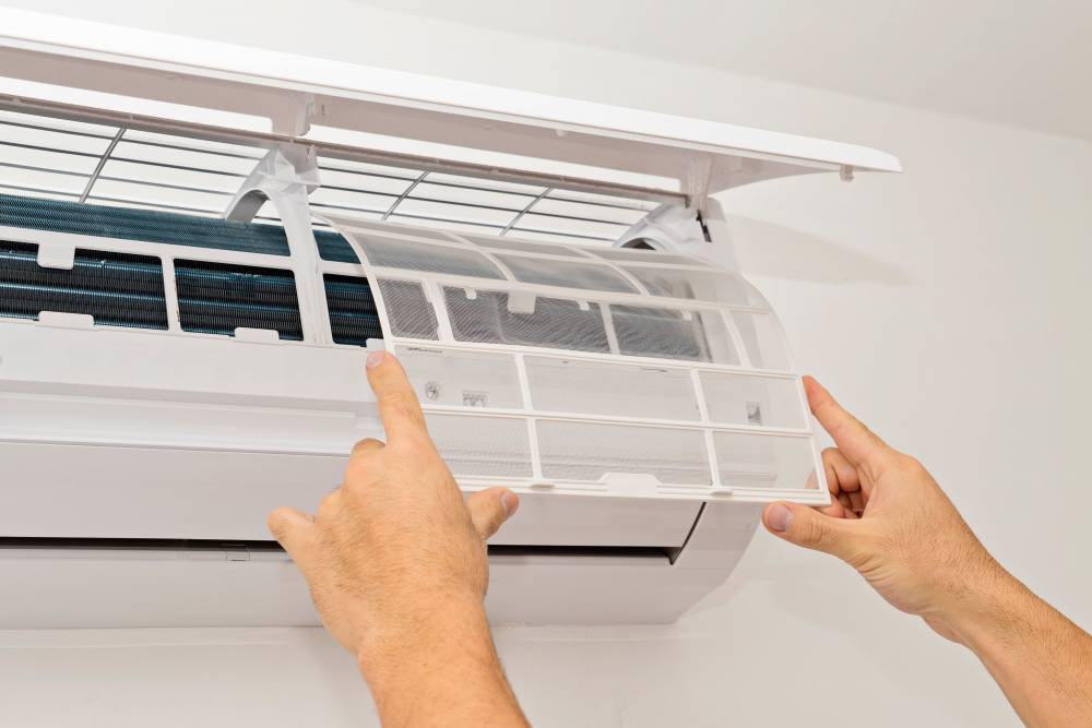changing-the-filter-of-the-air-conditioner-changi-2023-11-27-05-13-02-utc-min.jpg
